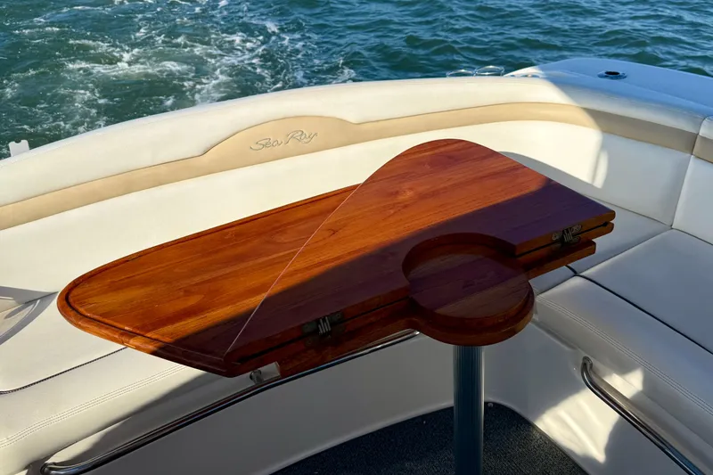Slide: The Image of Luxury seating area on 2009 Sea Ray Sundancer 350 yacht with wooden table. - 53