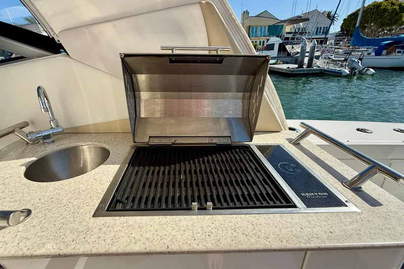 Slide: The Image of Outdoor grill and sink on 2009 Sea Ray Sundancer 350 yacht, docked at marina. - 56