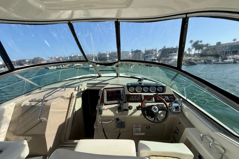 Slide: The Image of Interior view of 2009 Sea Ray Sundancer 350 yacht cockpit with steering wheel and dashboard. - 62