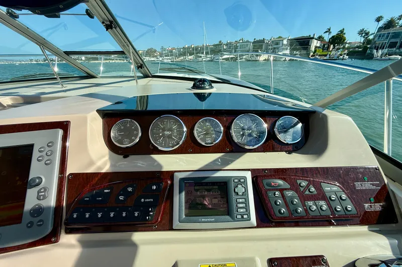 Slide: The Image of Cockpit view of 2009 Sea Ray Sundancer 350 with navigation instruments and gauges. - 63