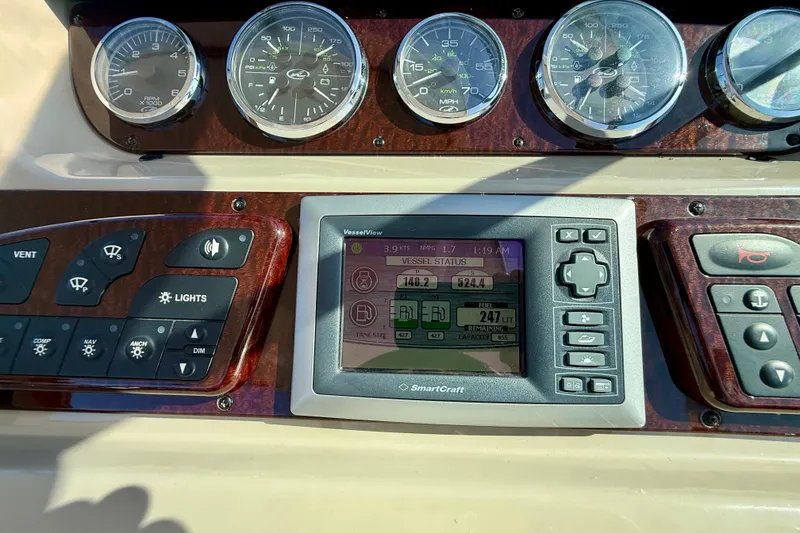 Slide: The Image of Dashboard of a 2009 Sea Ray Sundancer 350 with gauges and SmartCraft display. - 68