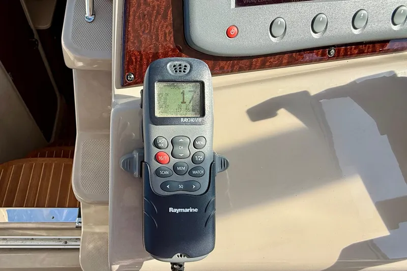 Slide: The Image of Raymarine RAY240 VHF radio on 2009 Sea Ray Sundancer 350 yacht dashboard. - 69