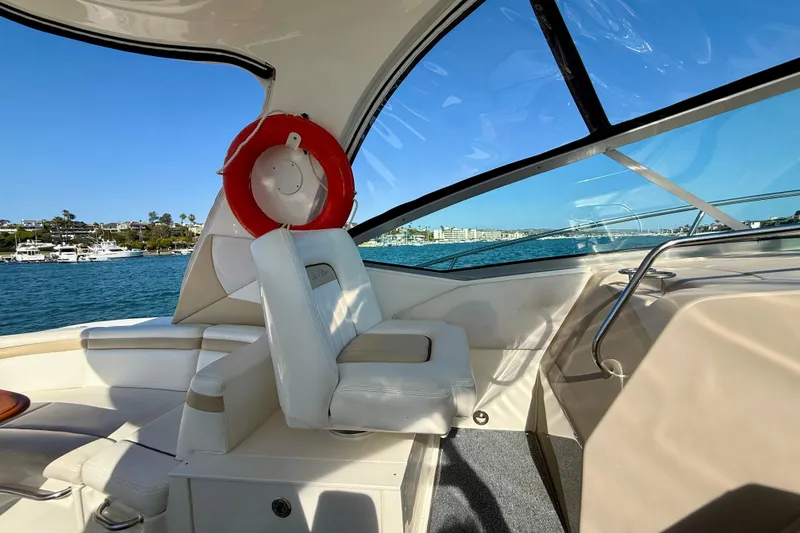 Slide: The Image of Interior view of 2009 Sea Ray Sundancer 350 yacht with life preserver and scenic water backdrop. - 72