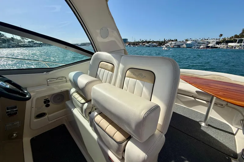 Slide: The Image of Interior of a 2009 Sea Ray Sundancer 350 yacht with plush seating and ocean view. - 73