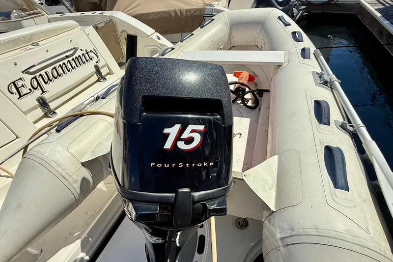 Slide: The Image of Outboard motor on inflatable boat near 2009 Sea Ray Sundancer 350 yacht. - 75