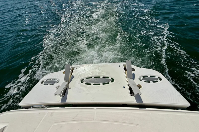 Slide: The Image of Rear view of 2009 Sea Ray Sundancer 350 boat cruising on open water. - 77