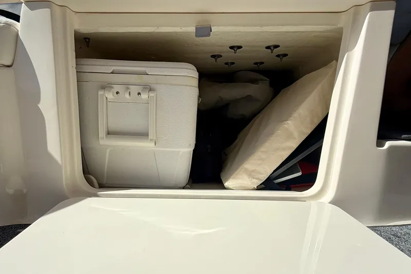 Slide: The Image of Storage compartment of a 2009 Sea Ray Sundancer 350 with cooler and cushions. - 79