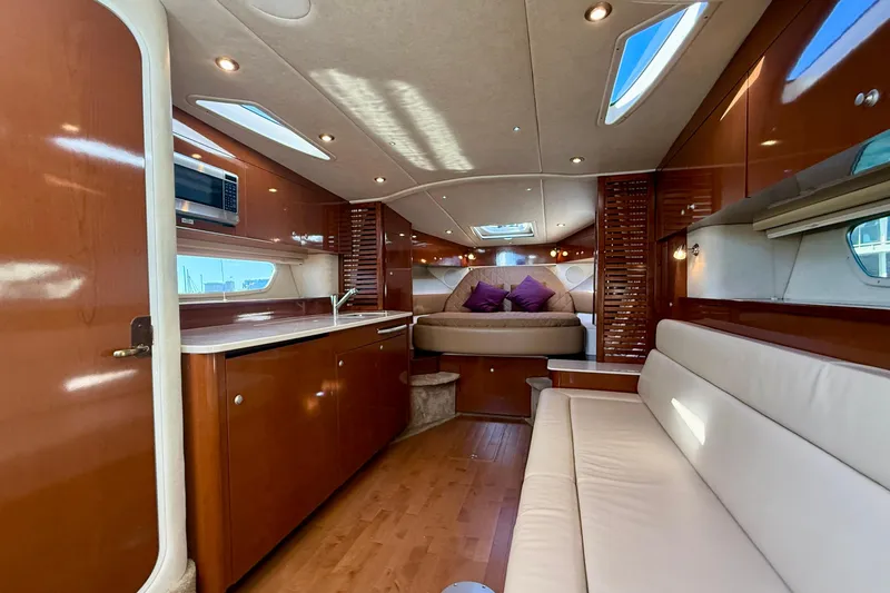 Slide: The Image of Luxurious interior of 2009 Sea Ray Sundancer 350 yacht with modern amenities and elegant design. - 8