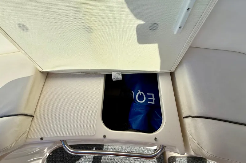 Slide: The Image of Storage compartment on a 2009 Sea Ray Sundancer 350 boat, partially open. - 80