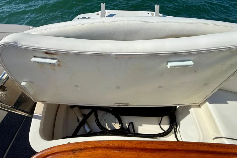 Slide: The Image of Open storage compartment on a 2009 Sea Ray Sundancer 350 boat, revealing interior space. - 81