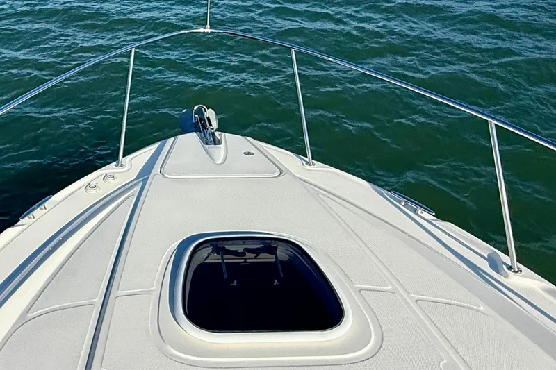 Slide: The Image of Bow view of 2009 Sea Ray Sundancer 350 on open water. - 84