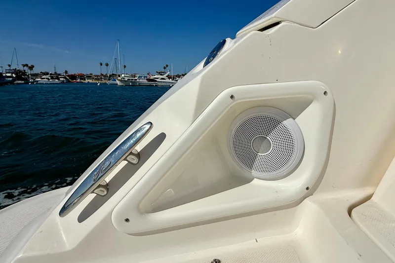 Slide: The Image of 2009 Sea Ray Sundancer 350 boat speaker and cleat detail with marina background. - 86