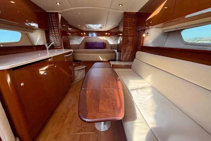 Slide: The Image of Luxurious interior of 2009 Sea Ray Sundancer 350 yacht with elegant wood finishes. - 9