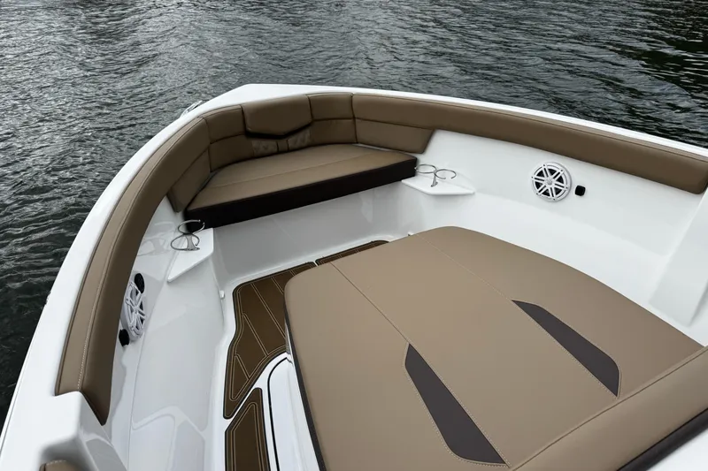 Slide: The Image of Luxurious seating on the 2026 Monterey Elite 25 OB boat, featuring elegant brown upholstery. - 16