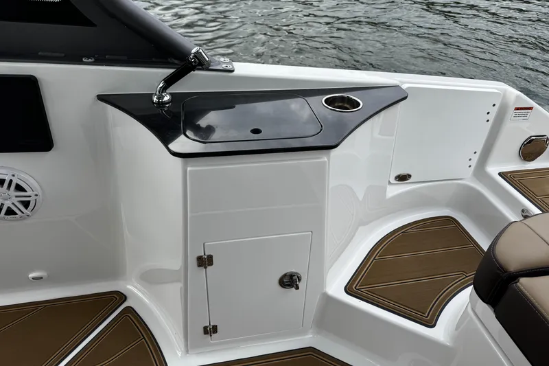 Slide: The Image of 2026 Monterey Elite 25 OB boat interior with sink and seating area. - 17