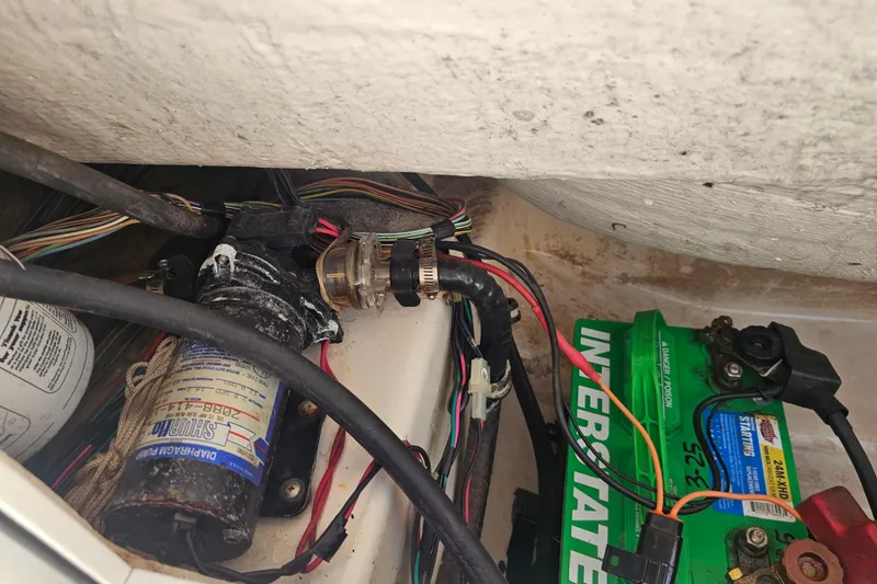 Slide: The Image of 1997 Wellcraft 190 CCF boat wiring and battery setup, featuring Interstate battery and wiring components. - 10