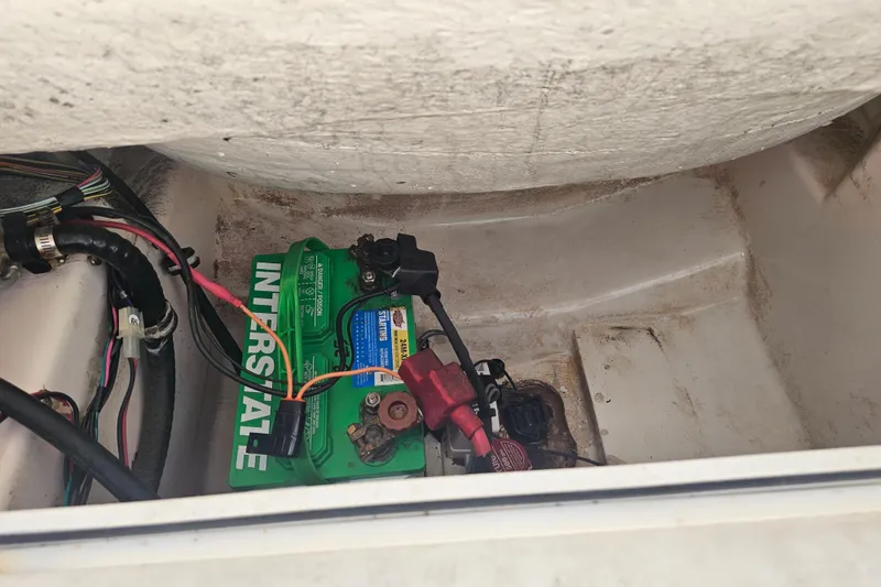 Slide: The Image of Battery compartment of a 1997 Wellcraft 190 CCF boat with Interstate battery. - 9