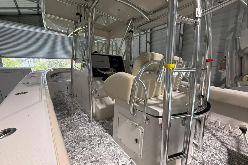 Slide: The Image of 2008 Jupiter 34 FS boat interior with helm, seating, and stainless steel framework. - 10