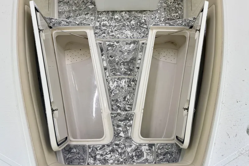 Slide: The Image of Open storage compartments on a 2008 Jupiter 34 FS boat deck. - 15