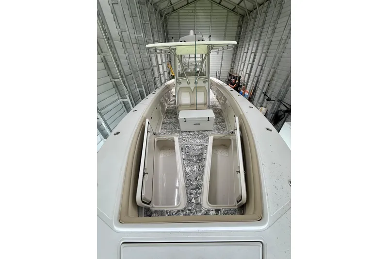 Slide: The Image of 2008 Jupiter 34 FS boat in storage, showcasing open compartments and sleek design. - 16