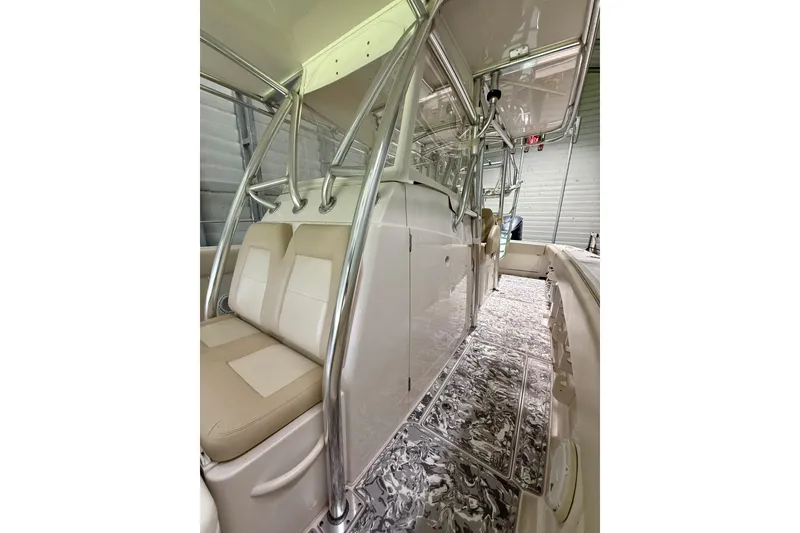 Slide: The Image of 2008 Jupiter 34 FS boat interior with beige seating and sleek metal framework. - 18