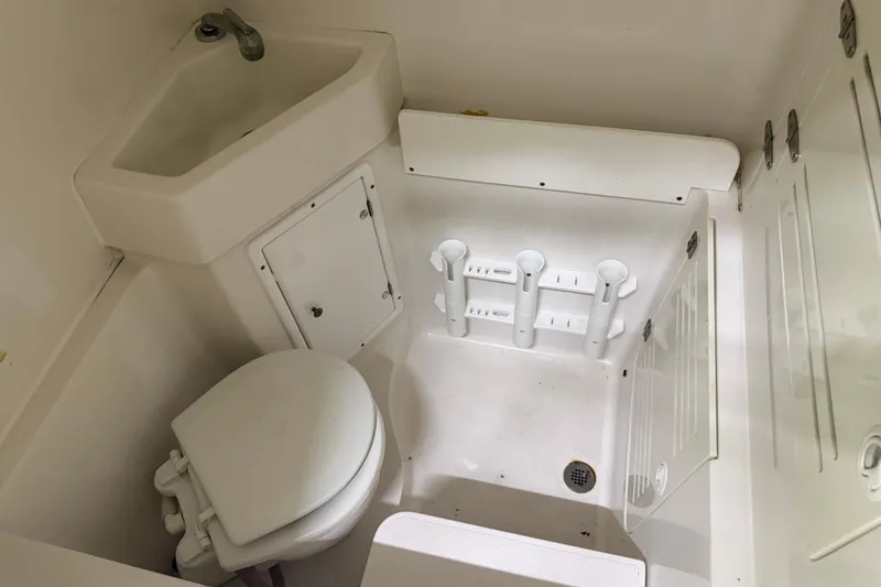 Slide: The Image of Compact bathroom in 2008 Jupiter 34 FS boat with sink and toilet. - 20