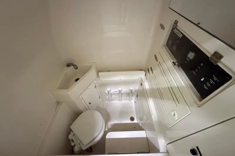 Slide: The Image of Compact bathroom in 2008 Jupiter 34 FS boat with sink and toilet. - 21