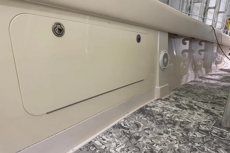 Slide: The Image of 2008 Jupiter 34 FS boat interior with storage compartment and patterned flooring. - 26
