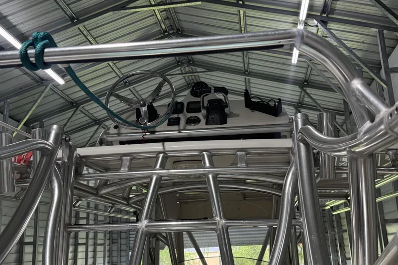 Slide: The Image of Interior view of a 2008 Jupiter 34 FS boat with metal framework and steering wheel. - 30