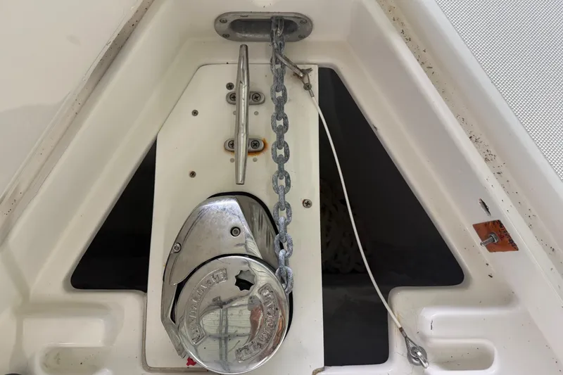 Slide: The Image of Anchor chain and winch on 2008 Jupiter 34 FS boat deck. - 34