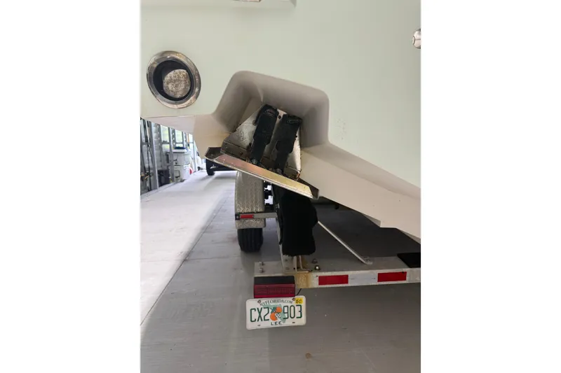Slide: The Image of Rear view of a 2008 Jupiter 34 FS boat on a trailer in a garage. - 36