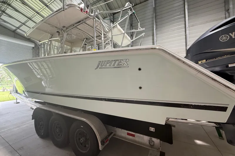 Slide: The Image of 2008 Jupiter 34 FS boat on trailer in storage facility. - 4