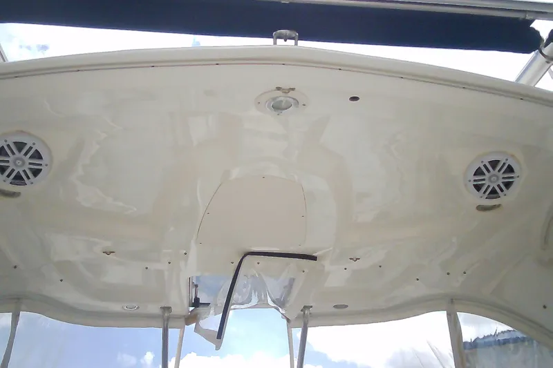 Slide: The Image of 2013 Chaparral 327 SSX boat interior ceiling with speakers and lighting fixtures. - 11