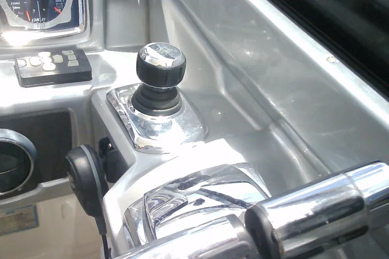 Slide: The Image of Control panel of a 2013 Chaparral 327 SSX boat with joystick and gauges. - 19