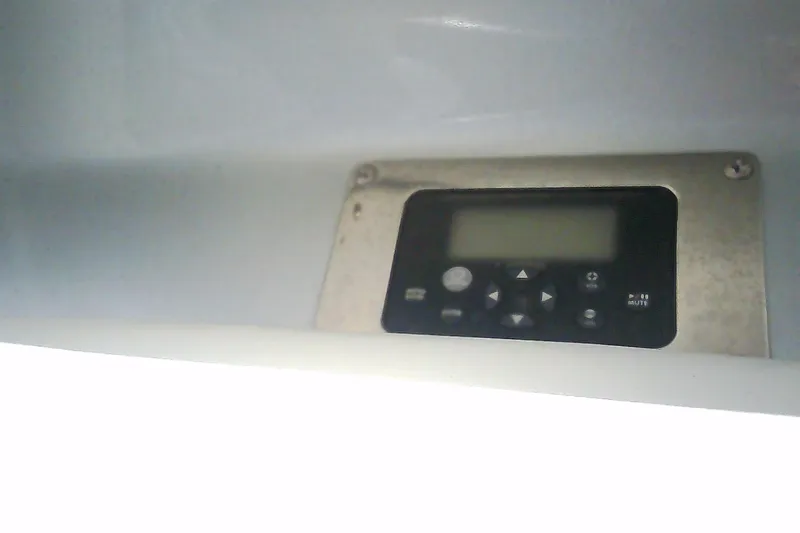 Slide: The Image of Control panel on a 2013 Chaparral 327 SSX boat dashboard. - 21