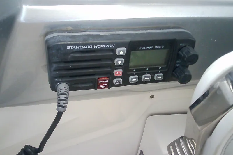 Slide: The Image of Standard Horizon Eclipse DSC+ radio on 2013 Chaparral 327 SSX boat dashboard. - 23