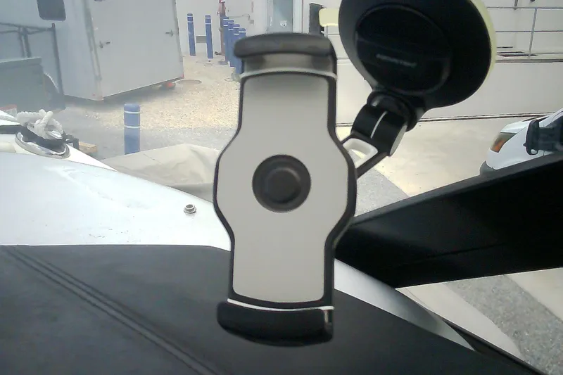 Slide: The Image of Phone holder mounted on a 2013 Chaparral 327 SSX dashboard. - 24
