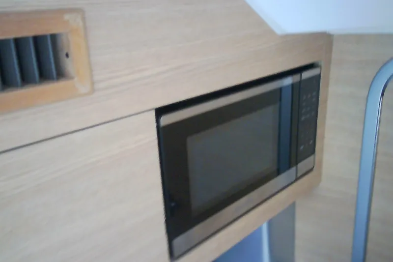 Slide: The Image of Built-in microwave in 2013 Chaparral 327 SSX boat interior. - 27