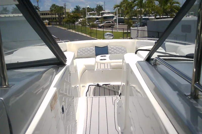 Slide: The Image of 2013 Chaparral 327 SSX boat interior with sleek seating and modern design. - 3