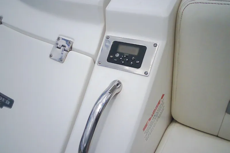 Slide: The Image of Control panel and handle on 2013 Chaparral 327 SSX boat interior. - 37