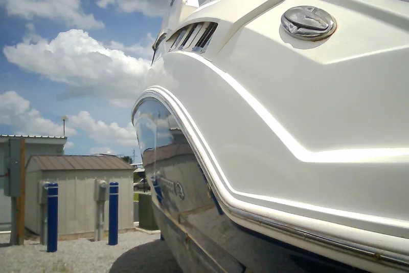 Slide: The Image of 2013 Chaparral 327 SSX boat close-up with blue sky background. - 40