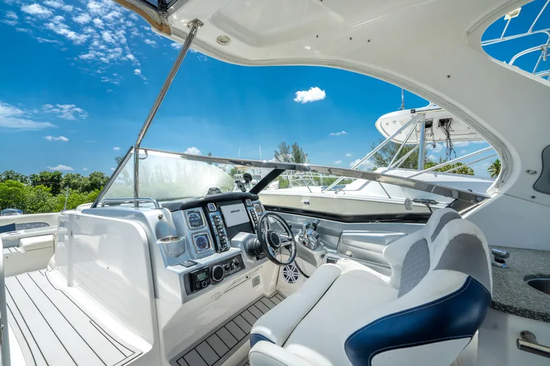 Slide: The Image of Cockpit of 2013 Chaparral 327 SSX boat with modern controls and seating. - 56