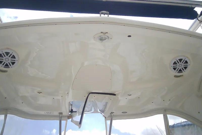 Slide: The Image of 2013 Chaparral 327 SSX boat interior ceiling with speakers and lighting fixtures. - 12