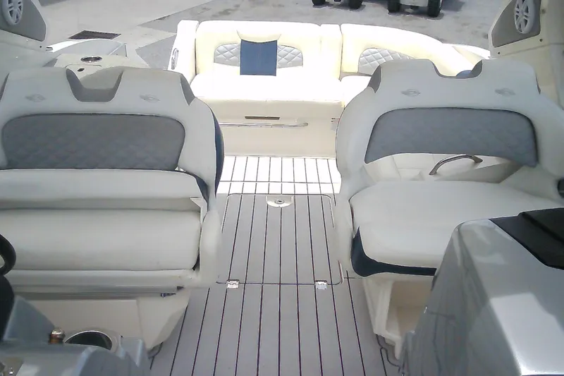 Slide: The Image of 2013 Chaparral 327 SSX boat interior with luxurious seating and sleek design. - 6
