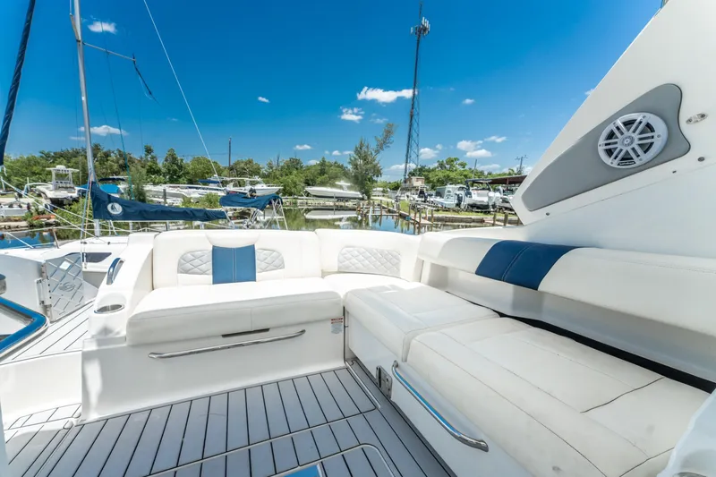 Slide: The Image of 2013 Chaparral 327 SSX boat interior with white seating and blue accents. - 66