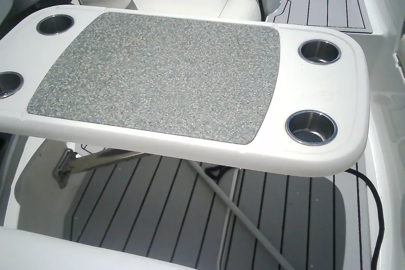 Slide: The Image of Cockpit table with cup holders on 2013 Chaparral 327 SSX boat. - 7