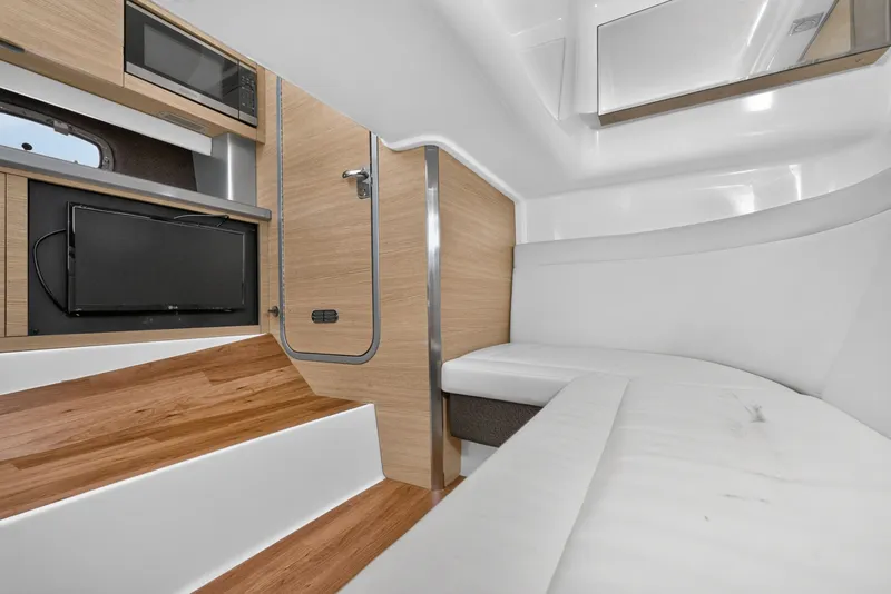 Slide: The Image of Interior of 2013 Chaparral 327 SSX boat with modern amenities and sleek design. - 40