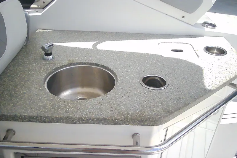 Slide: The Image of 2013 Chaparral 327 SSX boat kitchenette with sink and countertop. - 8