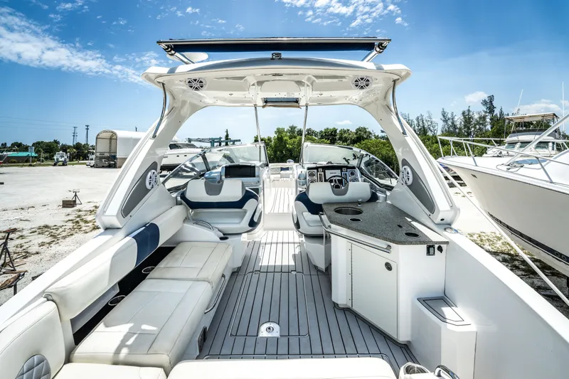 Slide: The Image of 2013 Chaparral 327 SSX boat interior with luxurious seating and modern amenities. - 48