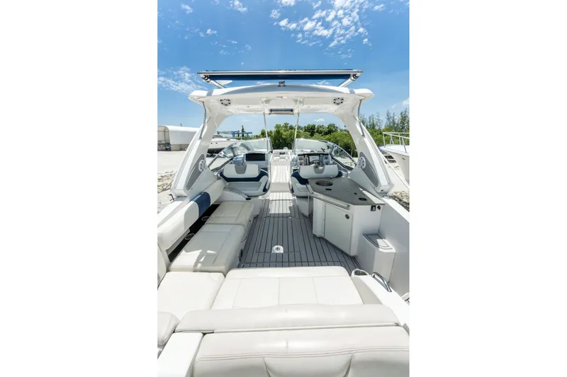 Slide: The Image of Interior view of 2013 Chaparral 327 SSX boat with spacious seating and sleek design. - 50